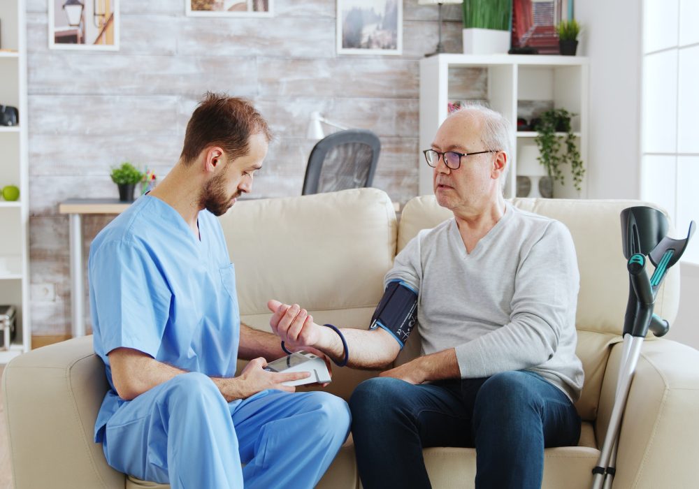 male-nurse-measuring-blood-pressure-of-a-man-pensioner.jpg